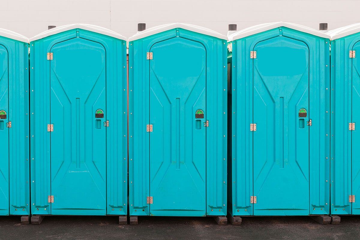 Industrial portable restroom units at a plant in Broad St, Los Angeles